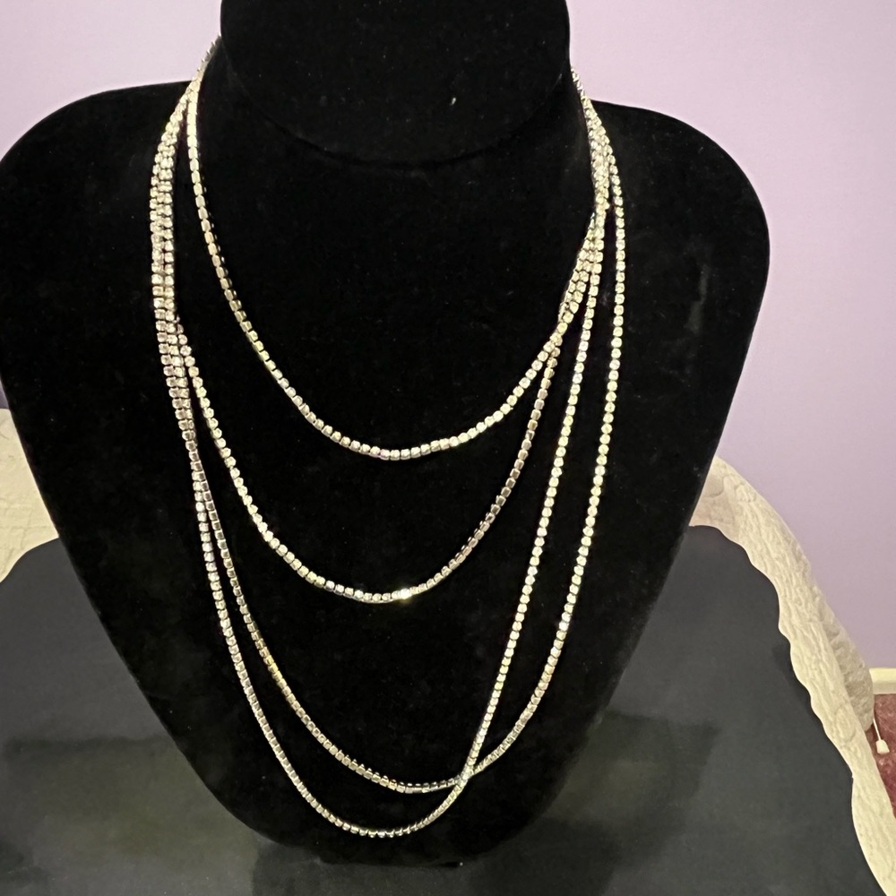 Gorgeous sparkly 70” silver tone necklace.